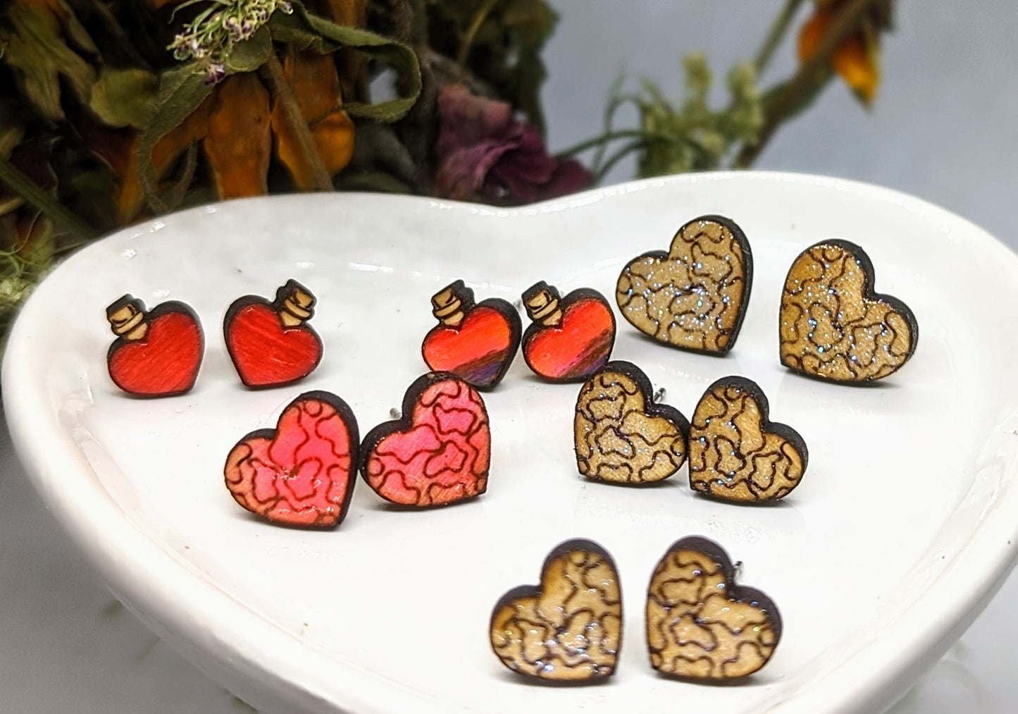 Heart potions and cow print studs